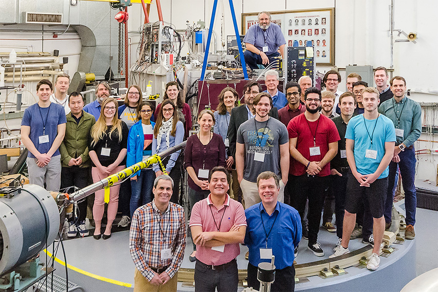 Physics faculty and graduate students in the lab.